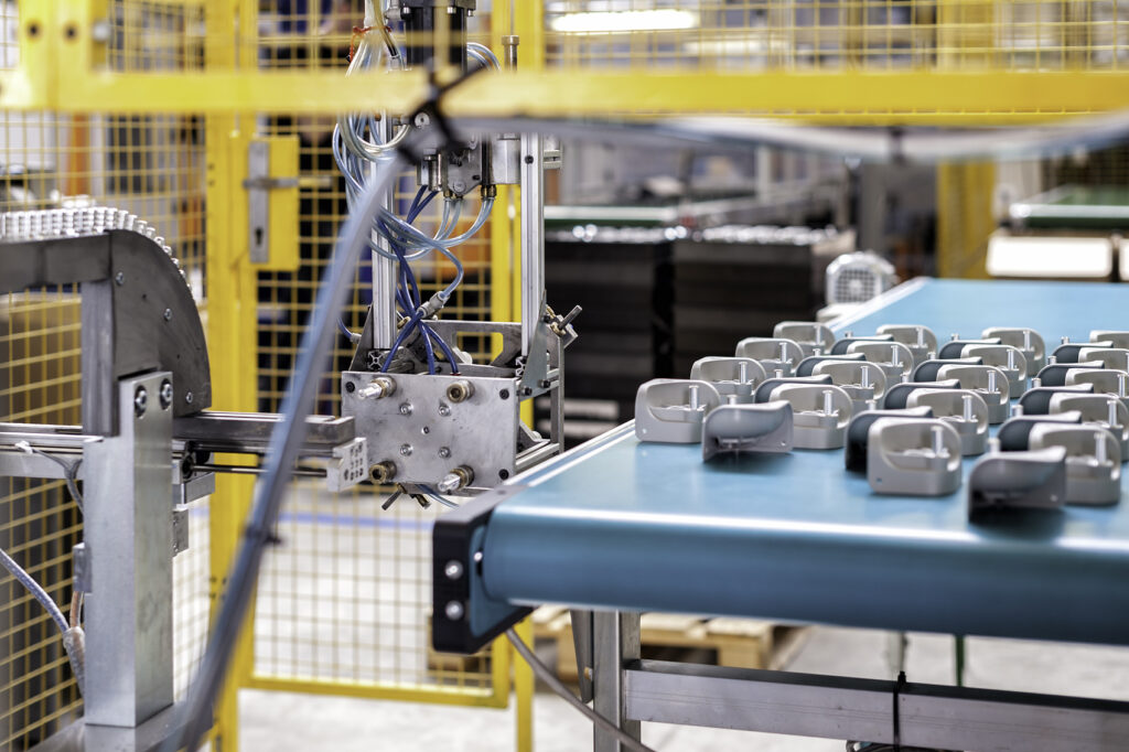 Industrial robotic arm and conveyor belt